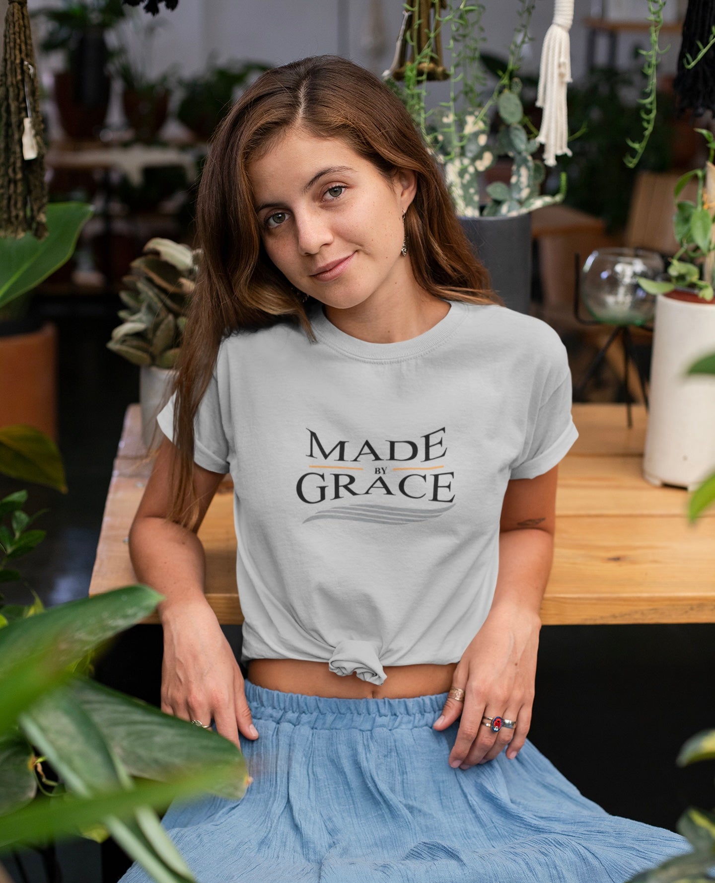 Organic Made By Grace T-shirt made from 100% organic cotton, featuring a ribbed neck collar and hemmed sleeves, available in various sizes.