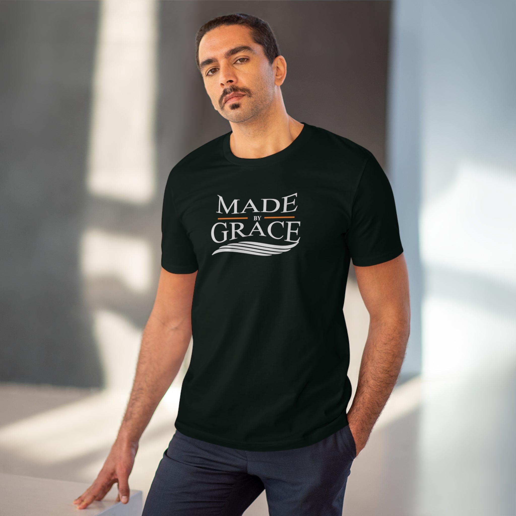 Organic Made By Grace T-shirt made from 100% organic cotton, featuring a ribbed neck collar and hemmed sleeves, available in various sizes.