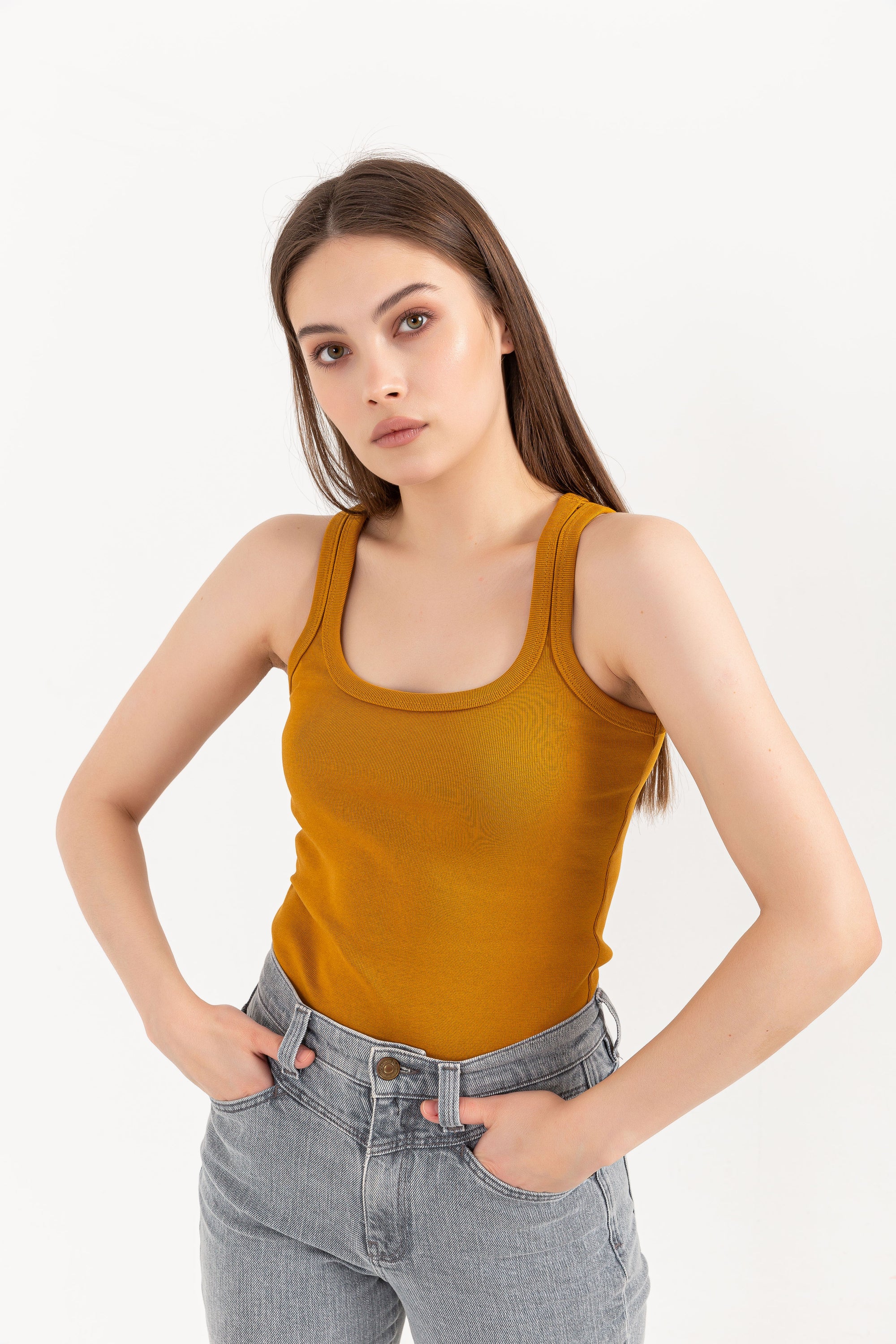 A stylish Organic Tank Top featuring a square neck design, made from 95% organic cotton and 5% elastane, displayed on a model.