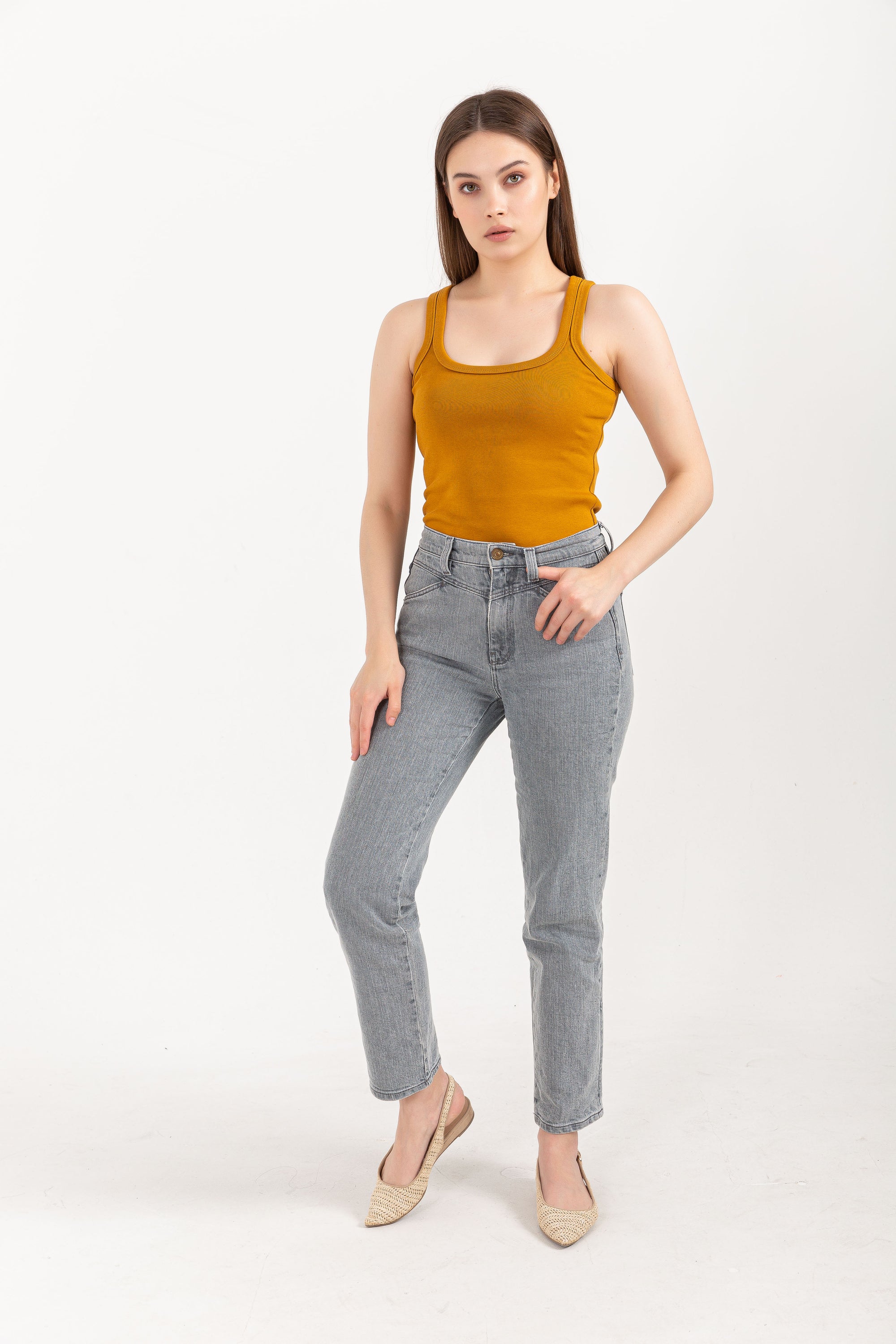 A stylish Organic Tank Top featuring a square neck design, made from 95% organic cotton and 5% elastane, displayed on a model.