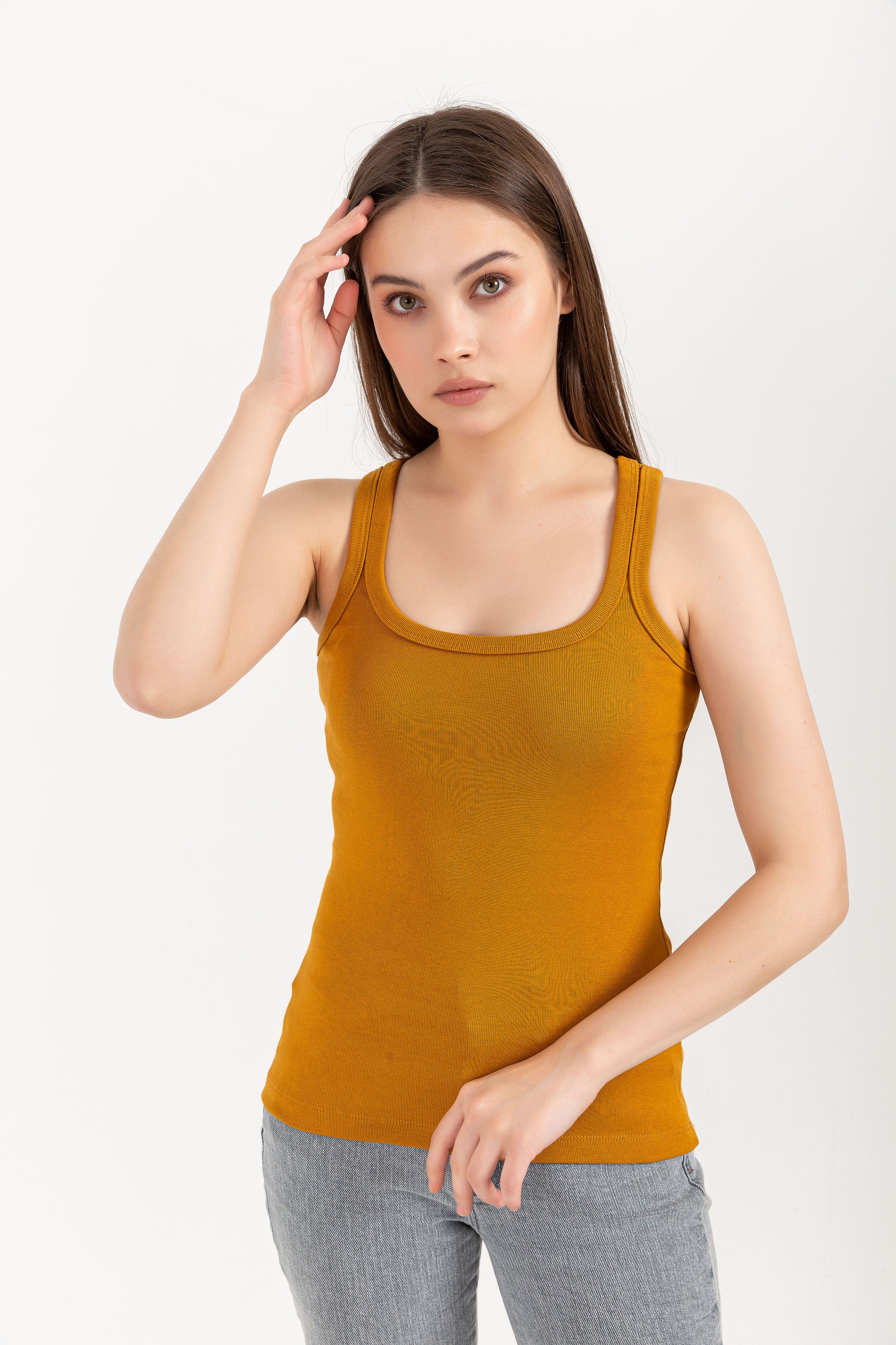 A stylish Organic Tank Top featuring a square neck design, made from 95% organic cotton and 5% elastane, displayed on a model.