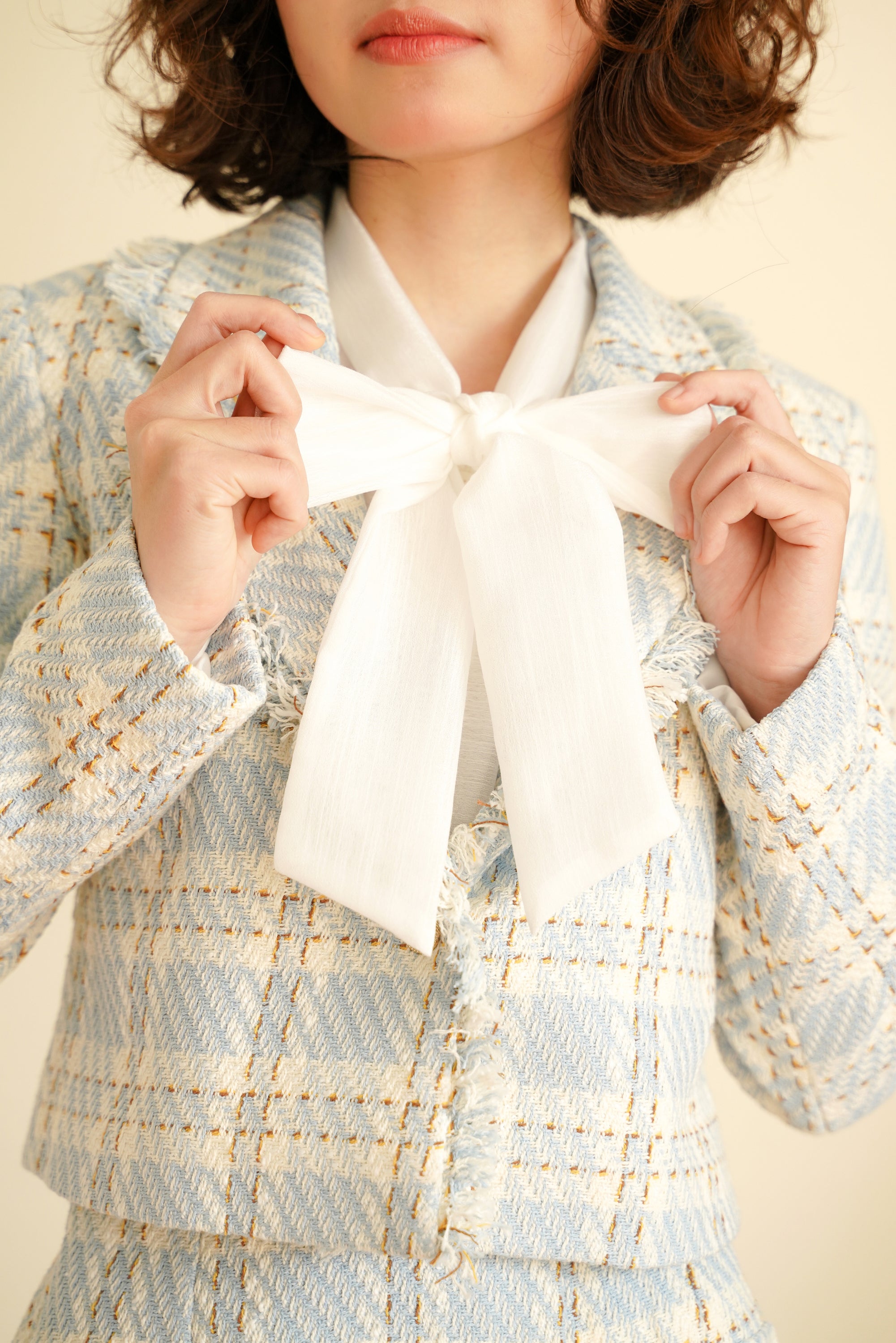 A stylish organza ribbon shirt featuring elegant ribbon detailing, perfect for various occasions.