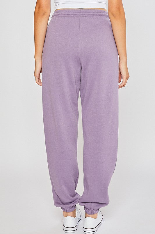 A pair of soft and smooth oversized sweatpants in a relaxed fit, perfect for lounging or casual outings.