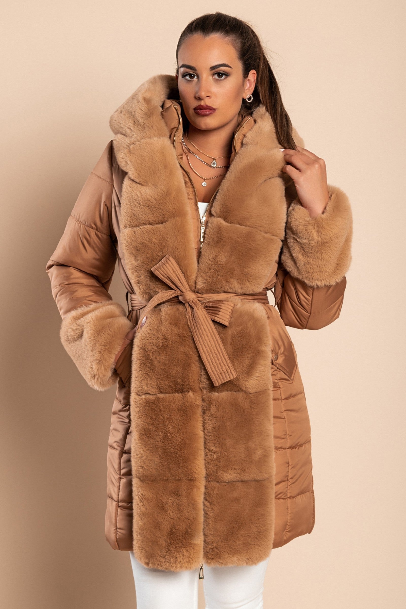 Camel padded jacket with faux fur trim, featuring a metal zipper and side pockets, designed for warmth and style.