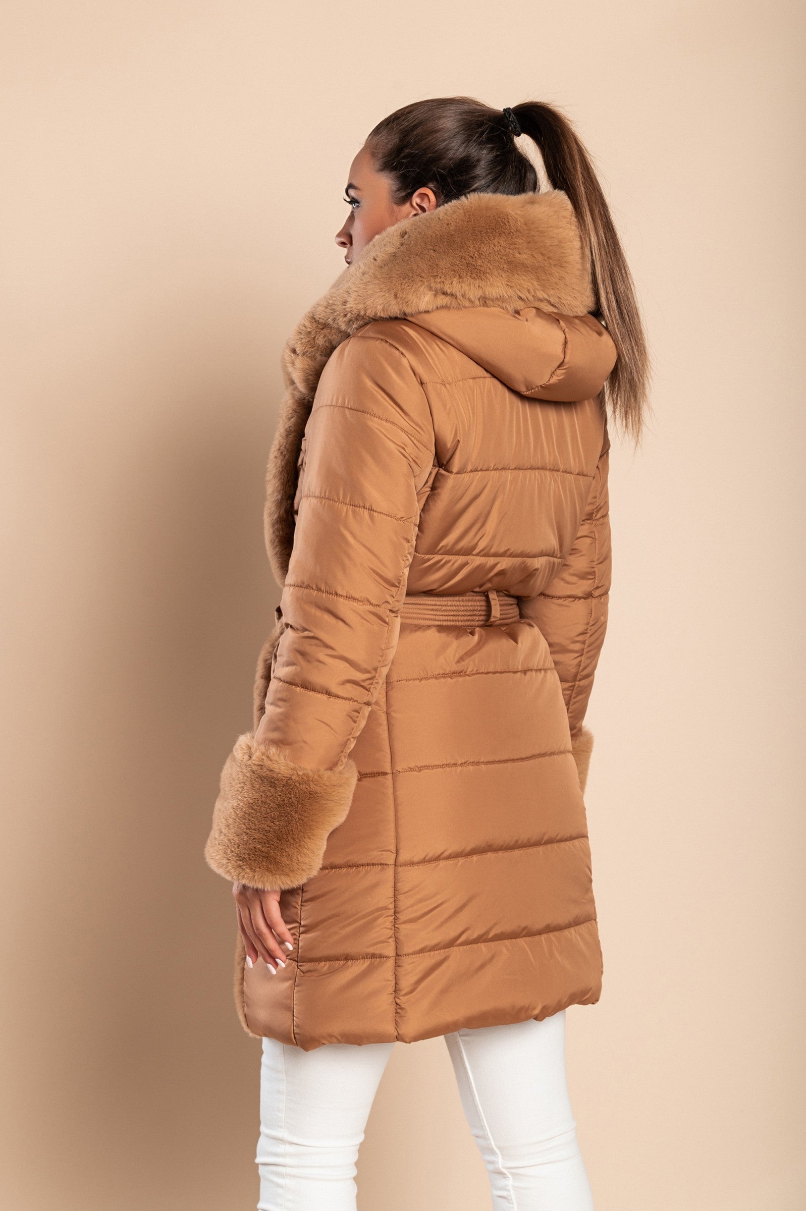 Camel padded jacket with faux fur trim, featuring a quilted design, side pockets, and a metal zipper closure.