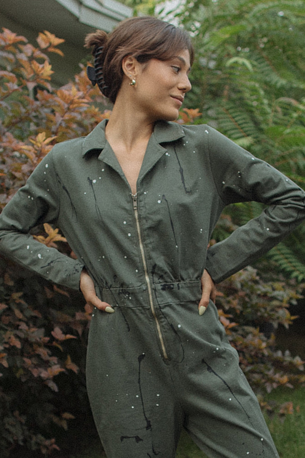 A stylish Painter Jumpsuit in indigo and olive colors, made from 100% organic cotton, showcasing its relaxed fit and comfortable design.