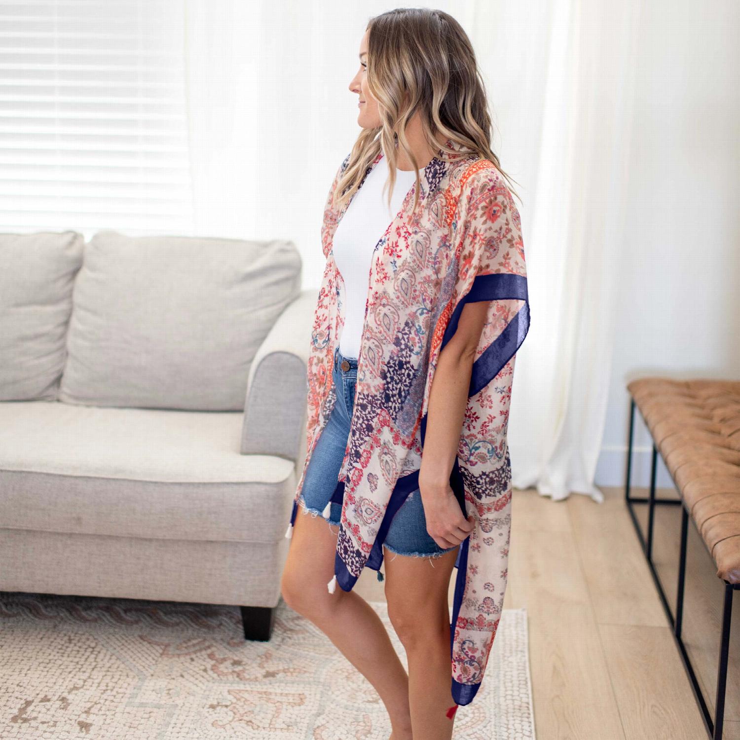 A vibrant Paisley Floral Patchwork Kimono featuring colorful floral patterns, perfect for layering over summer outfits.