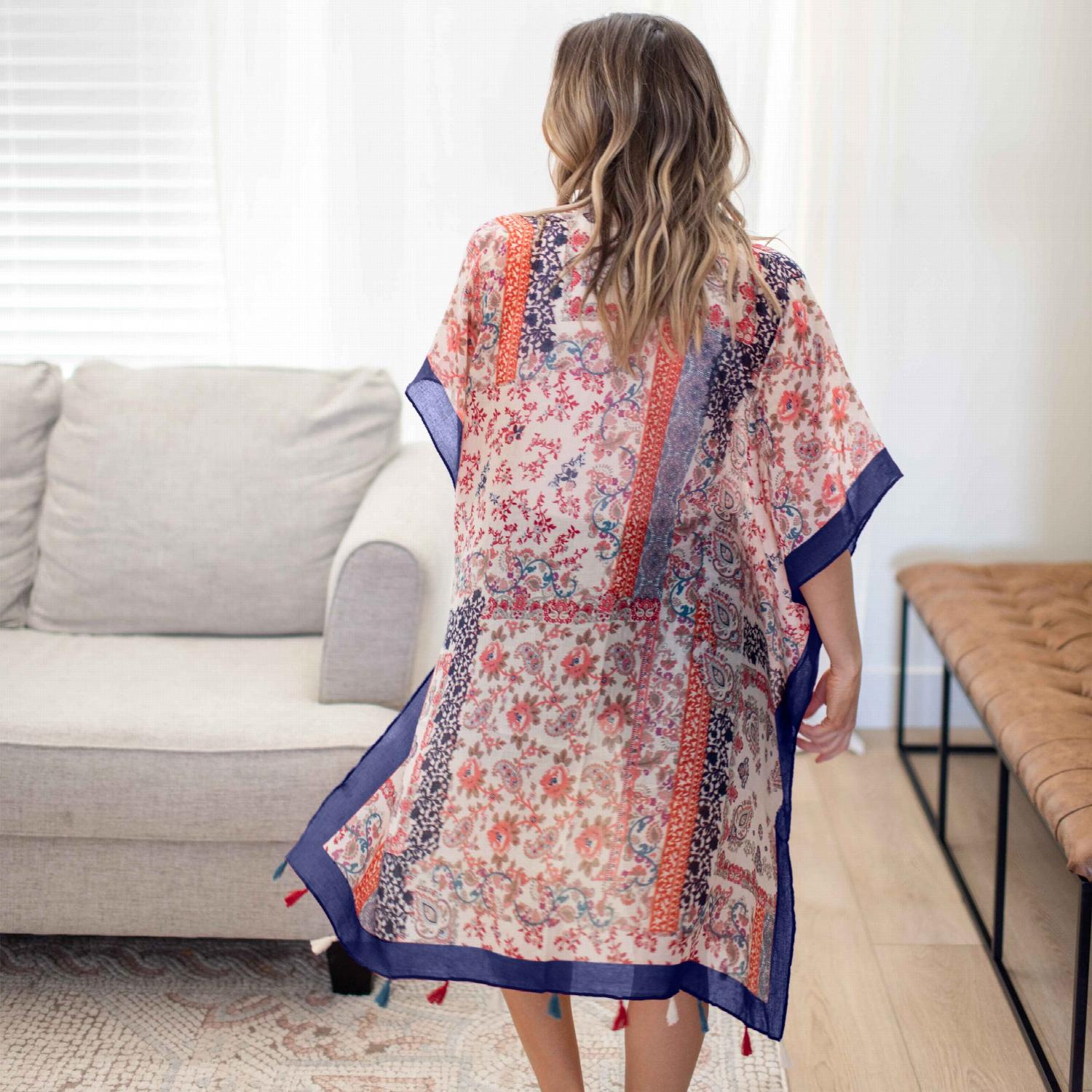 A vibrant Paisley Floral Patchwork Kimono featuring colorful floral patterns, perfect for layering over summer outfits.