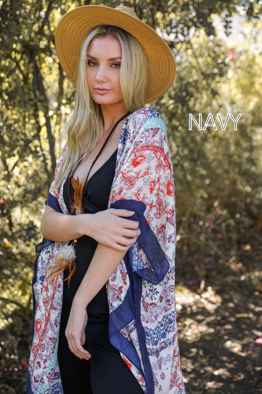 A vibrant Paisley Floral Patchwork Kimono featuring colorful floral patterns, perfect for layering over summer outfits.