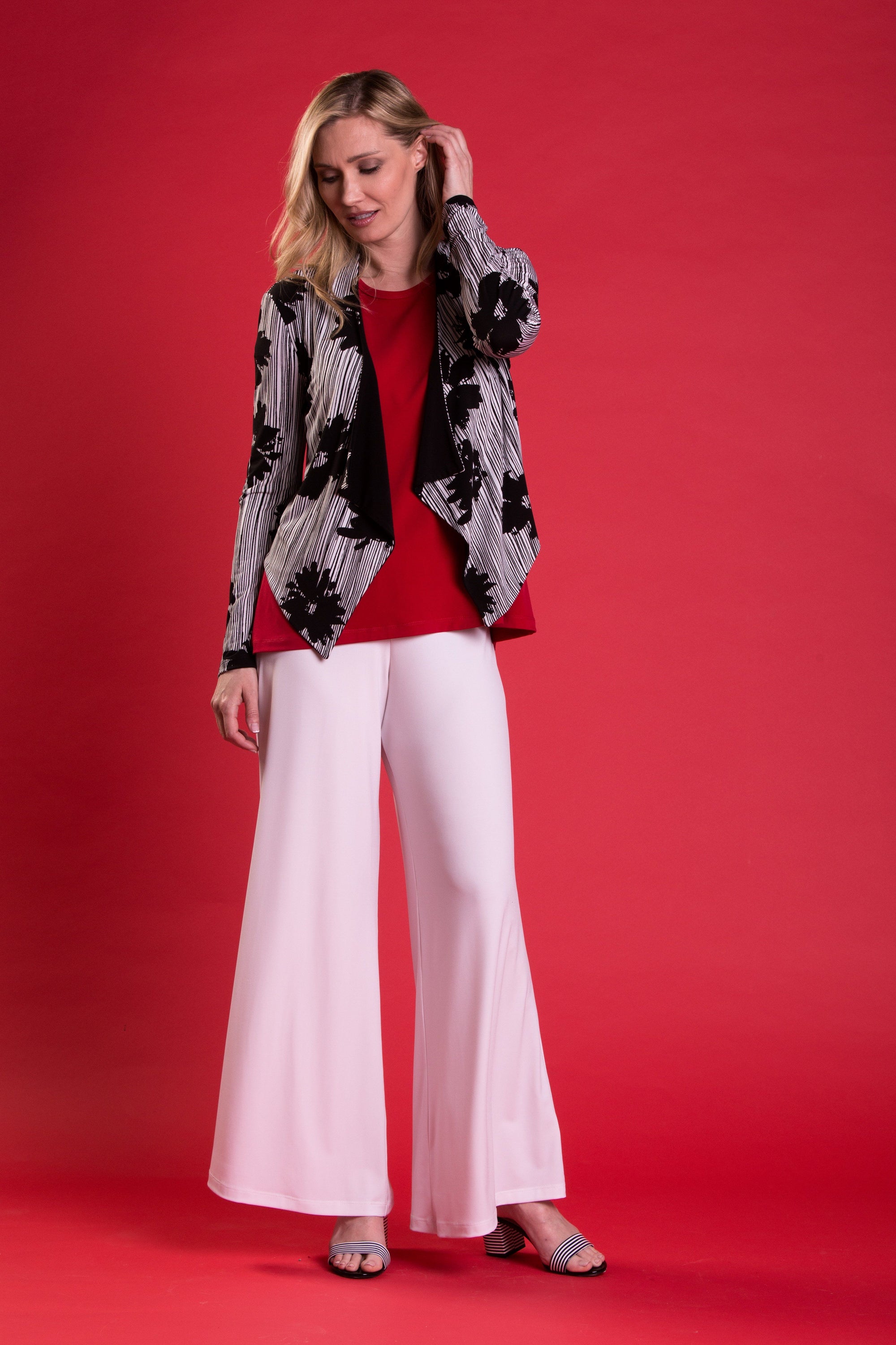 A pair of elegant Signature Palazzo Pants with a wide band elastic waist, showcasing a flattering drape and stylish design, perfect for various occasions.