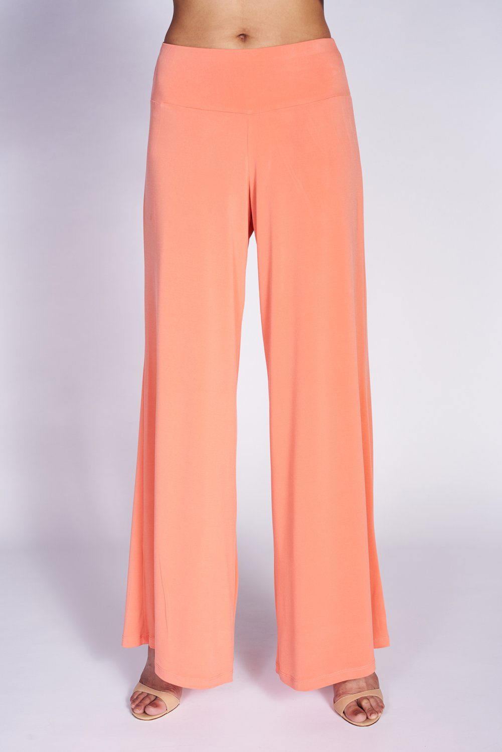 A pair of elegant Signature Palazzo Pants with a wide band elastic waist, showcasing a flattering drape and stylish design, perfect for various occasions.