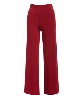 A pair of elegant Signature Palazzo Pants with a wide band elastic waist, showcasing a flattering drape and stylish design, perfect for various occasions.