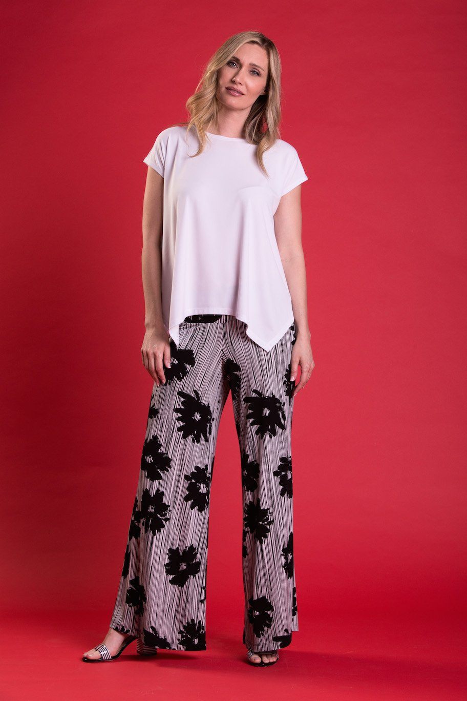 A pair of elegant Signature Palazzo Pants with a wide band elastic waist, showcasing a flattering drape and stylish design, perfect for various occasions.