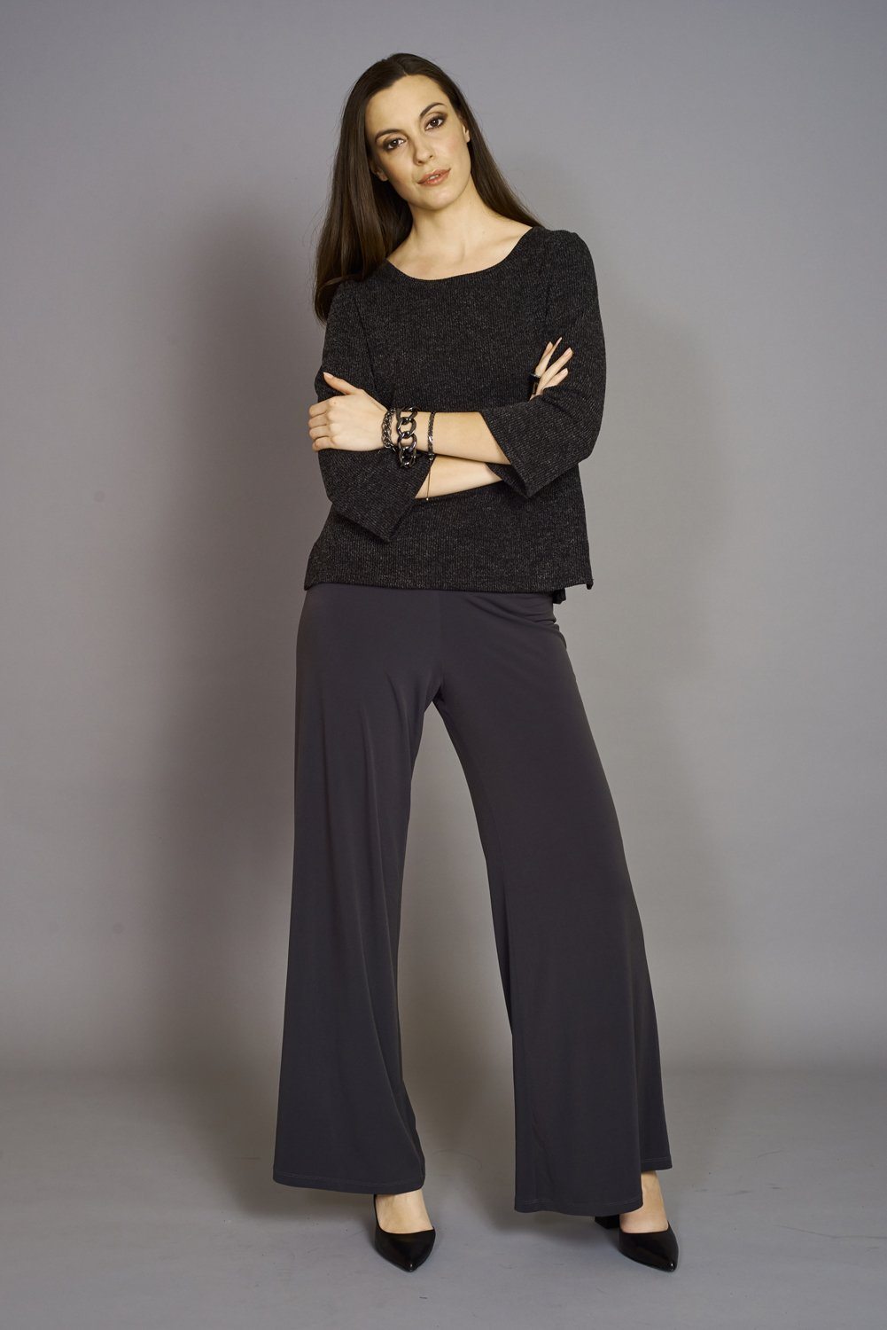 A pair of elegant Signature Palazzo Pants with a wide band elastic waist, showcasing a flattering drape and stylish design, perfect for various occasions.