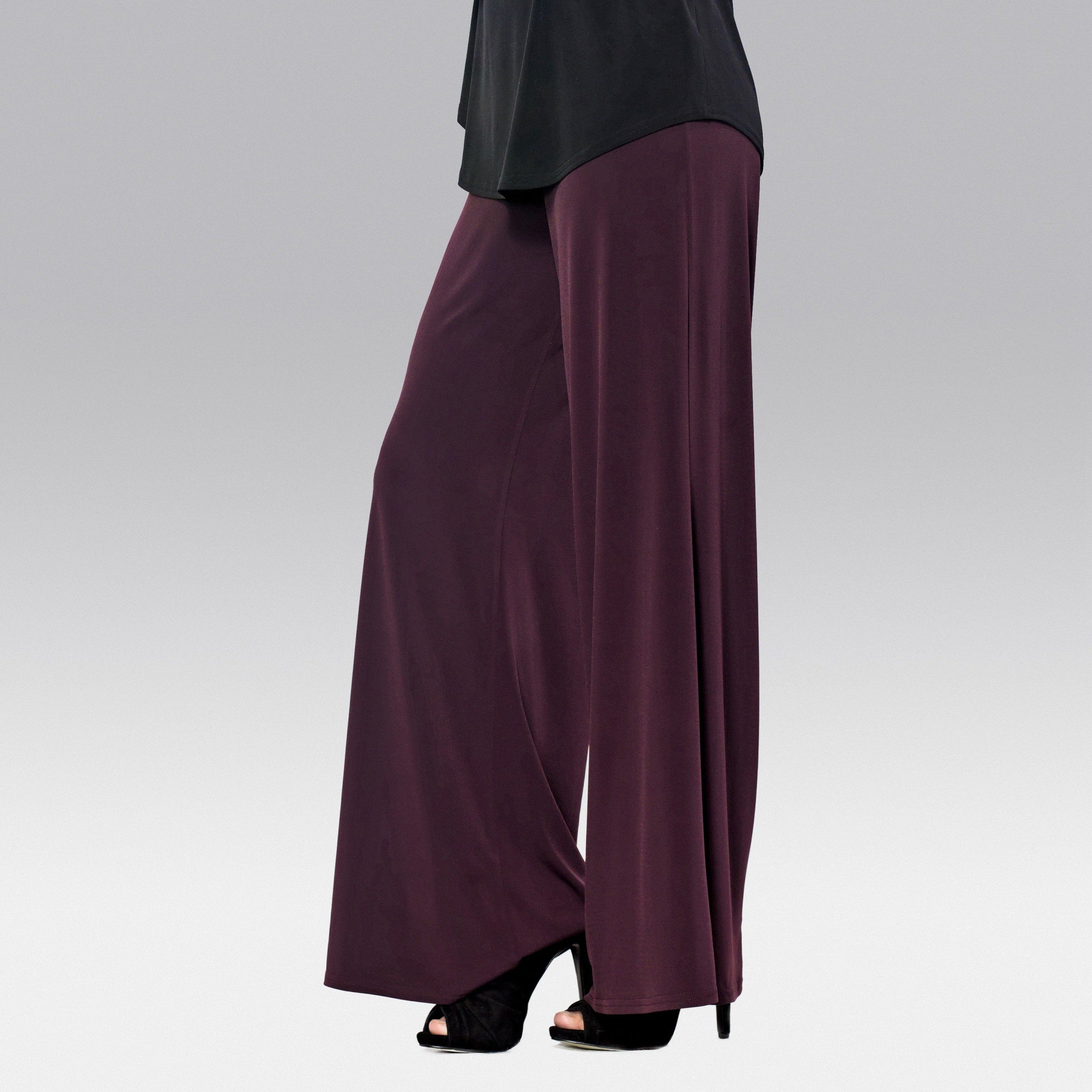 A pair of elegant Signature Palazzo Pants with a wide band elastic waist, showcasing a flattering drape and stylish design, perfect for various occasions.