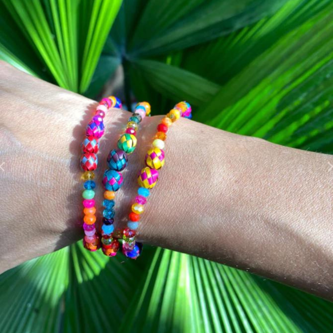 Colorful handcrafted Palm Bracelet made from dyed palm beads, showcasing vibrant patterns and artisan craftsmanship.