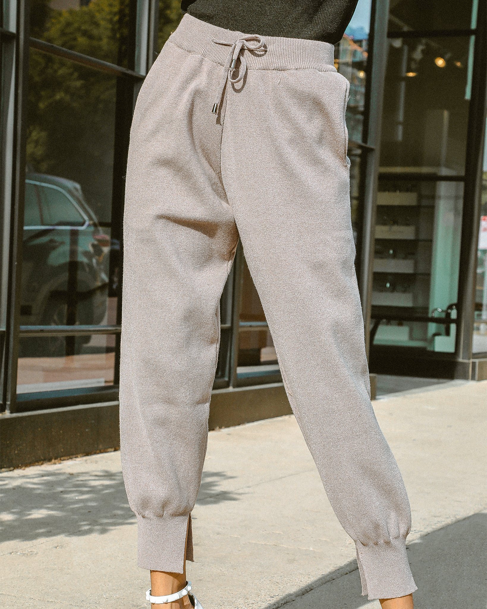 Paloma Tapered Joggers showcasing a relaxed fit, drawstring waist, and stylish side slits, perfect for casual chic outfits.