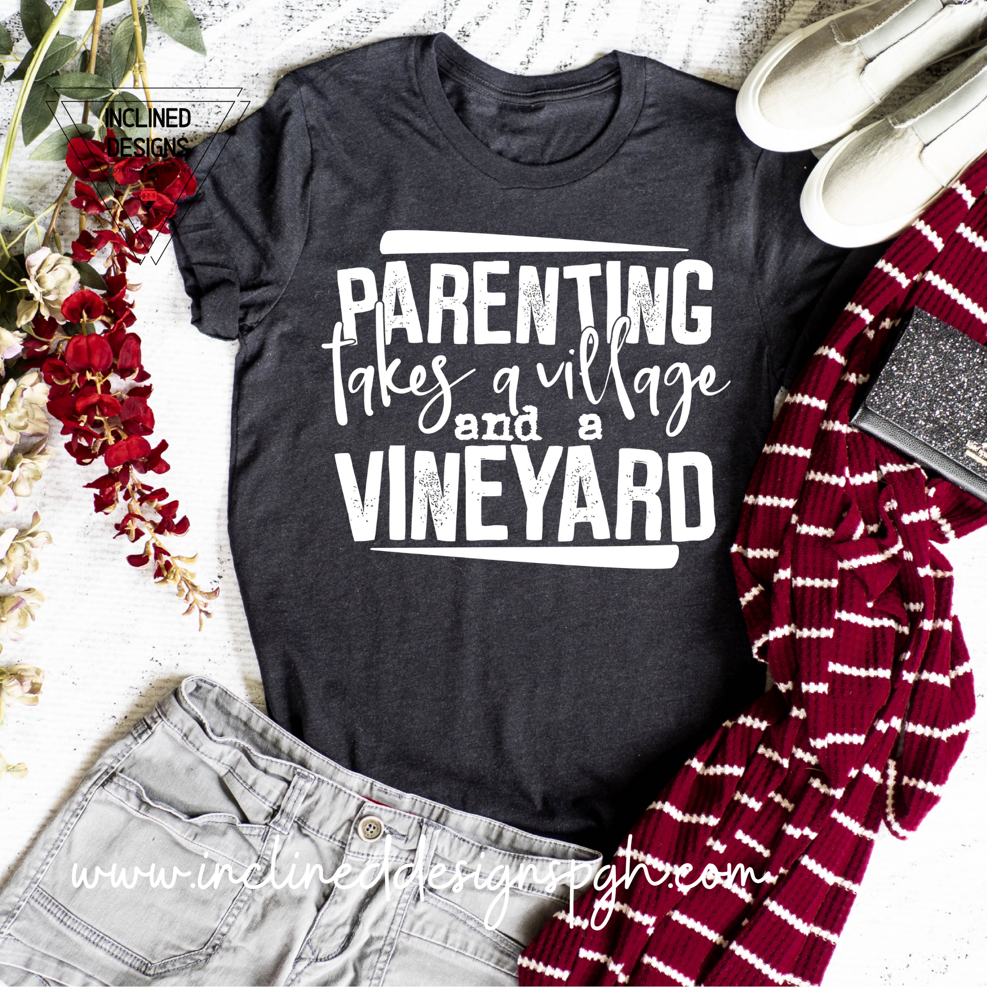 A stylish screen printed adult tee featuring the phrase 'Parenting Takes A Vineyard', perfect for wine-loving parents.