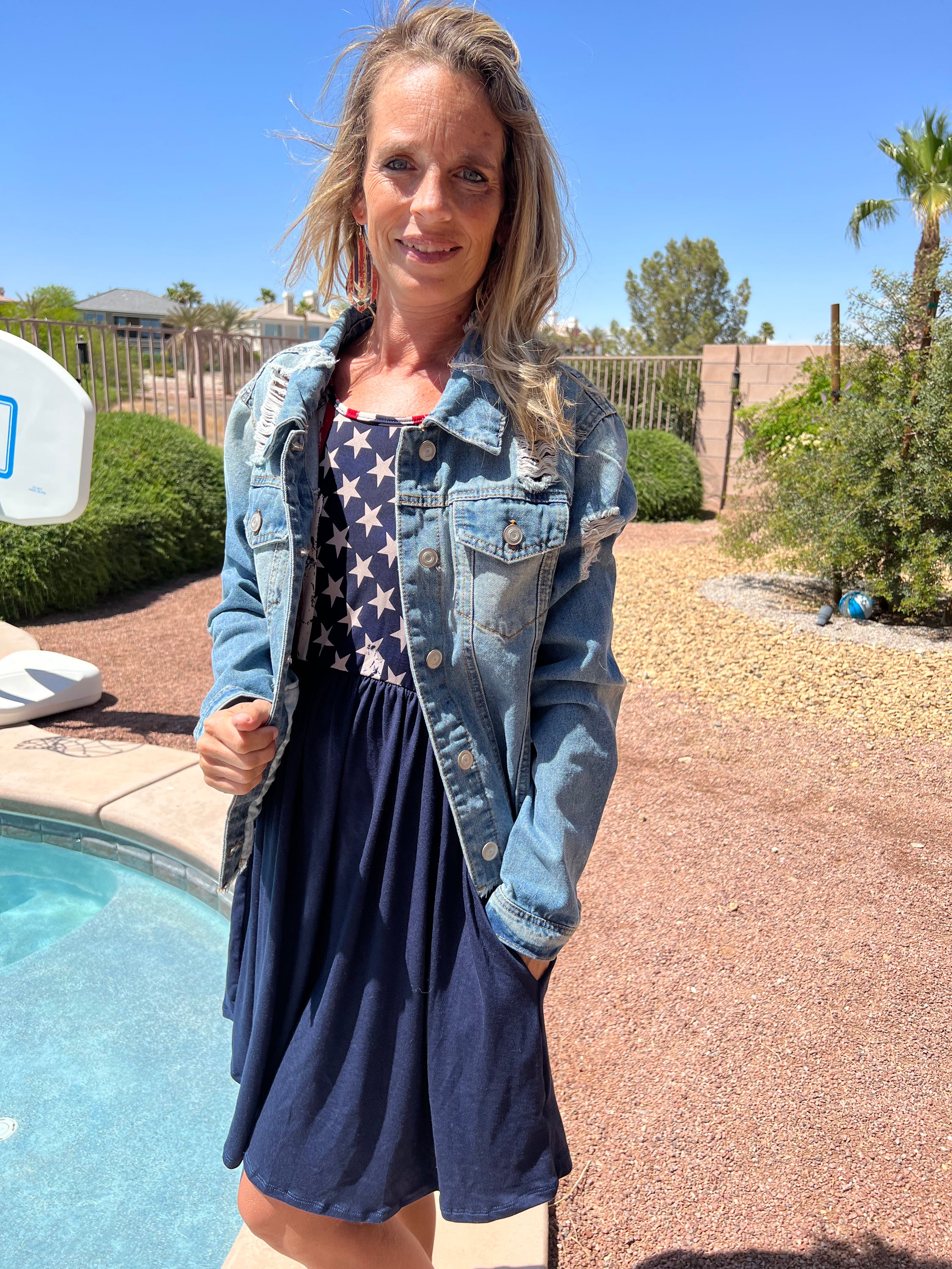 A stylish patriotic knit dress featuring an elastic waist and tank style design, perfect for summer celebrations.