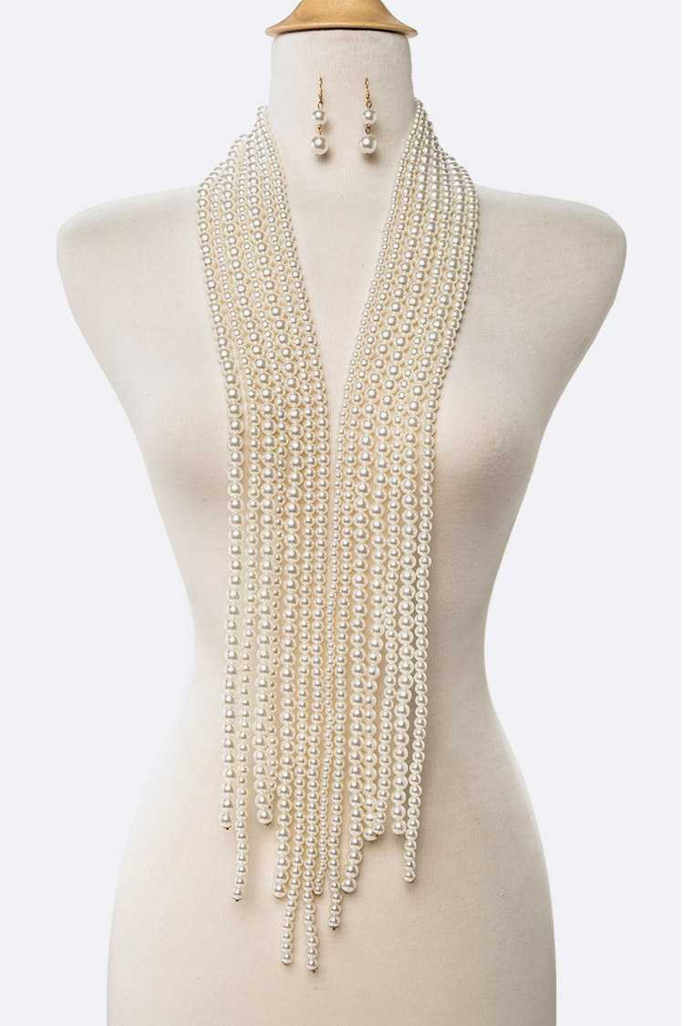 Elegant Pearl Knotted Necklace OS with matching earrings, showcasing a versatile design for various styles.