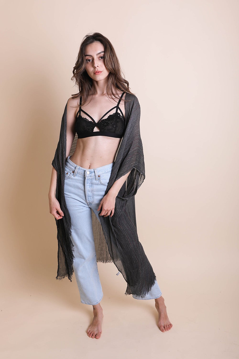 A stylish Pencil Stripe Lurex Trim Kimono featuring a chic pencil stripe pattern and elegant lurex trim, perfect for summer outings.