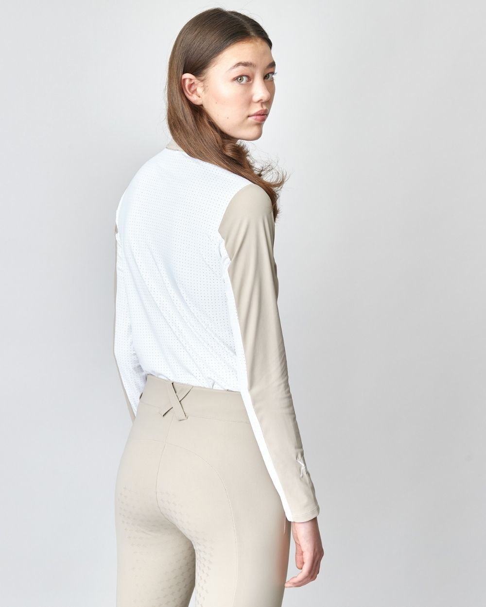 Performance Sun Shirt Tan featuring mesh details for breathability and UV protection, designed for outdoor activities.