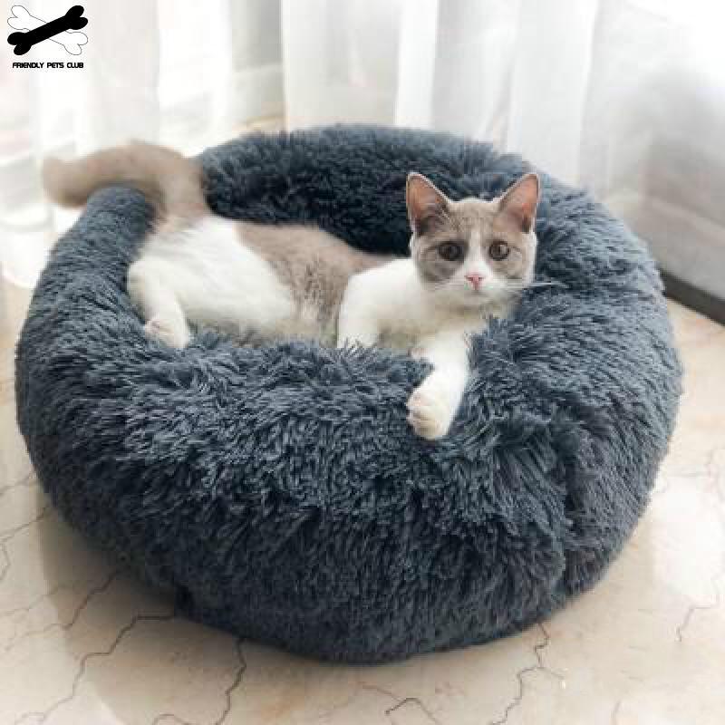 A cozy round dog bed in soft corduroy material, designed for comfort and security, perfect for small to medium-sized dogs.