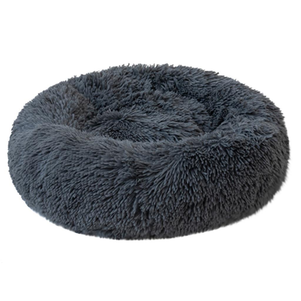 A cozy round dog bed in soft corduroy material, designed for comfort and security, perfect for small to medium-sized dogs.