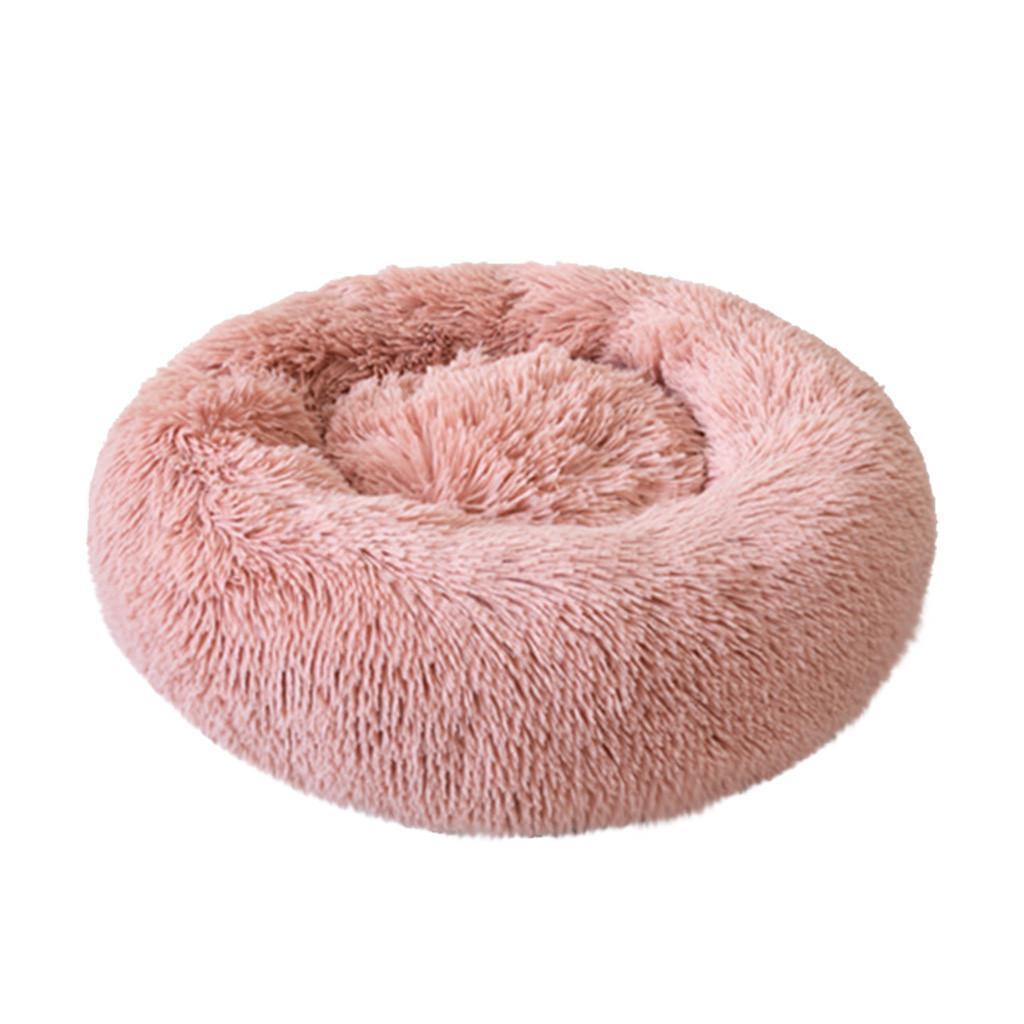 A cozy round dog bed in soft corduroy material, designed for comfort and security, perfect for small to medium-sized dogs.