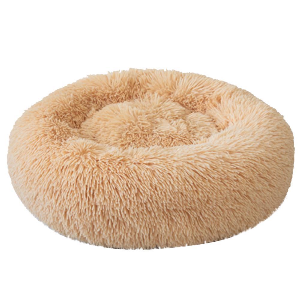 A cozy round dog bed in soft corduroy material, designed for comfort and security, perfect for small to medium-sized dogs.