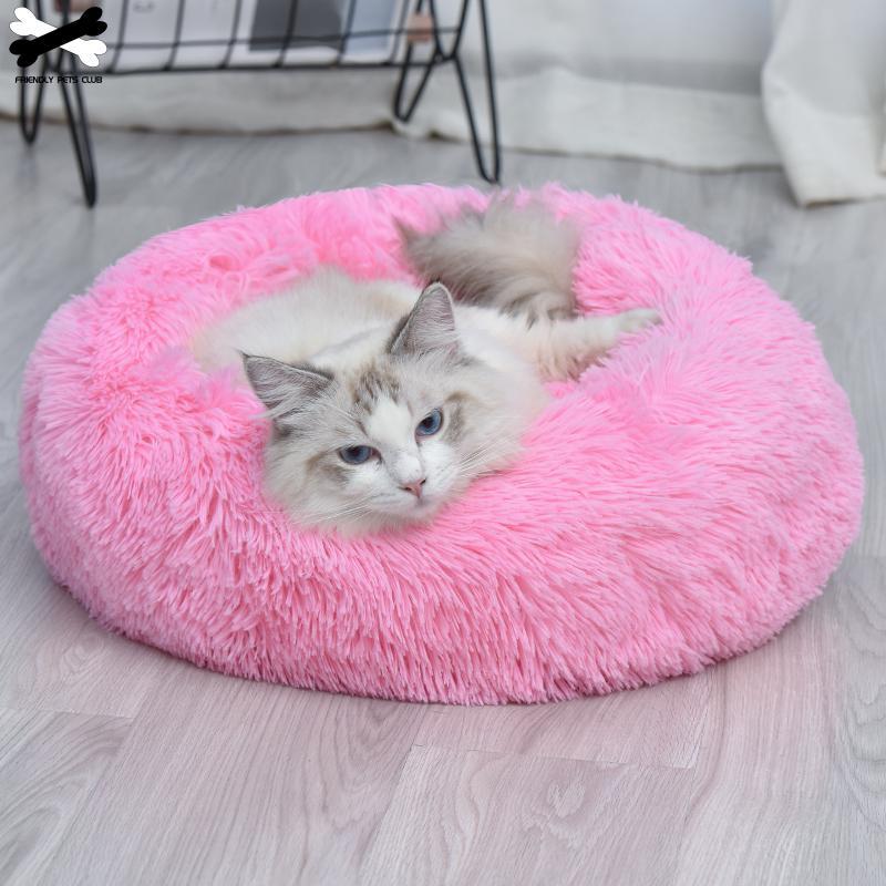 A cozy round dog bed in soft corduroy material, designed for comfort and security, perfect for small to medium-sized dogs.