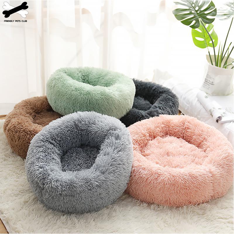 A cozy round dog bed in soft corduroy material, designed for comfort and security, perfect for small to medium-sized dogs.