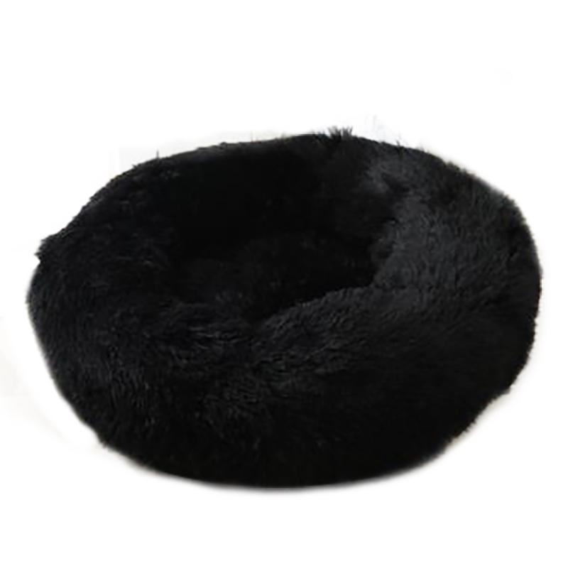 A cozy round dog bed in soft corduroy material, designed for comfort and security, perfect for small to medium-sized dogs.