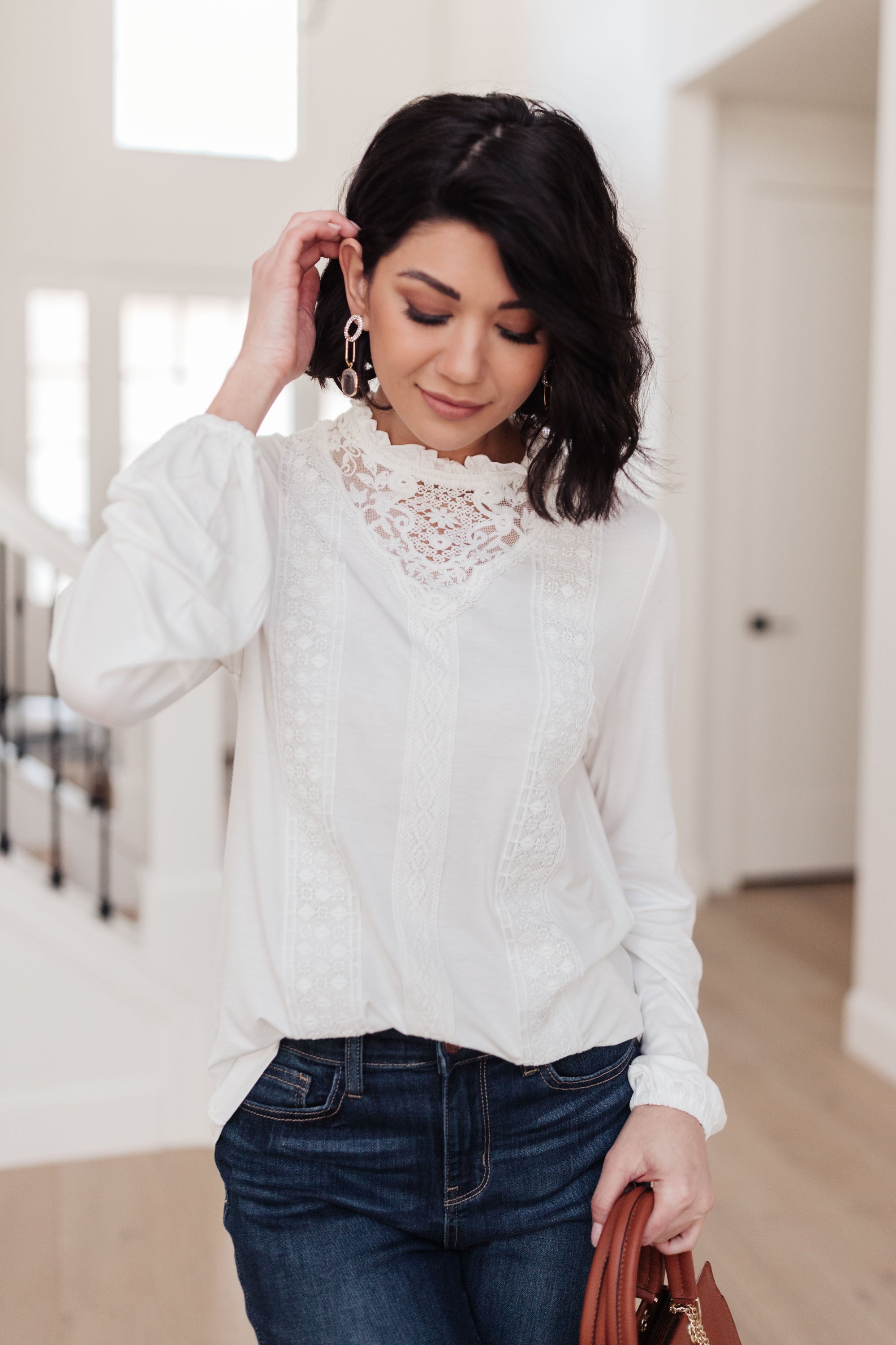 A stylish off white top featuring ruffles and lace overlay, perfect for a Cottage Core aesthetic.