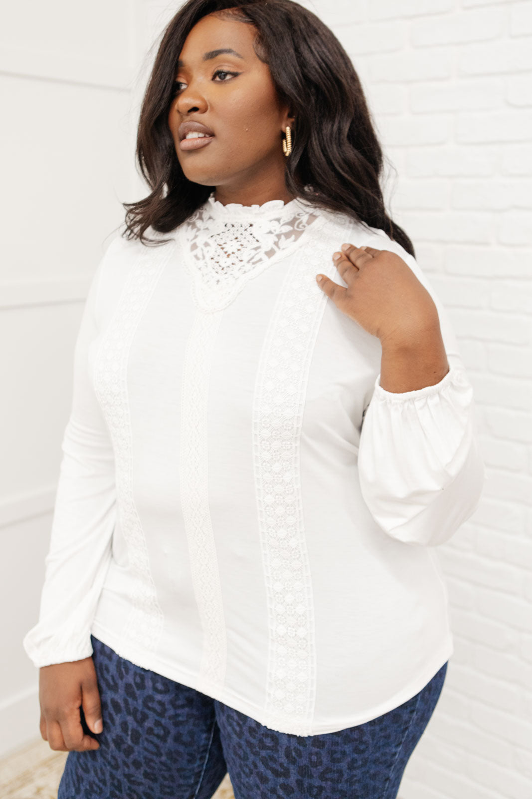 A stylish off white top featuring ruffles and lace overlay, perfect for a Cottage Core aesthetic.