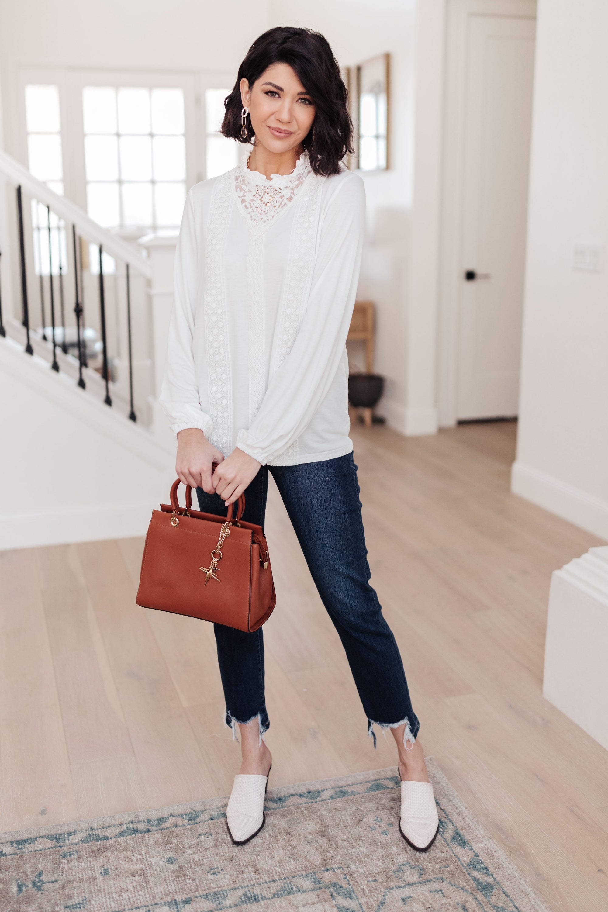 A stylish off white top featuring ruffles and lace overlay, perfect for a Cottage Core aesthetic.