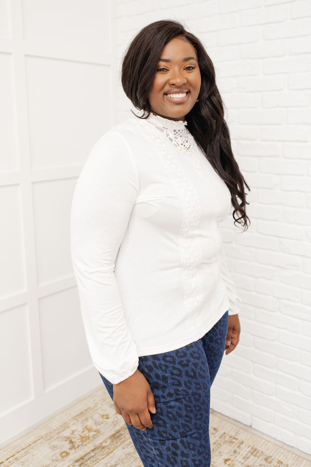 A stylish off white top featuring ruffles and lace overlay, perfect for a Cottage Core aesthetic.