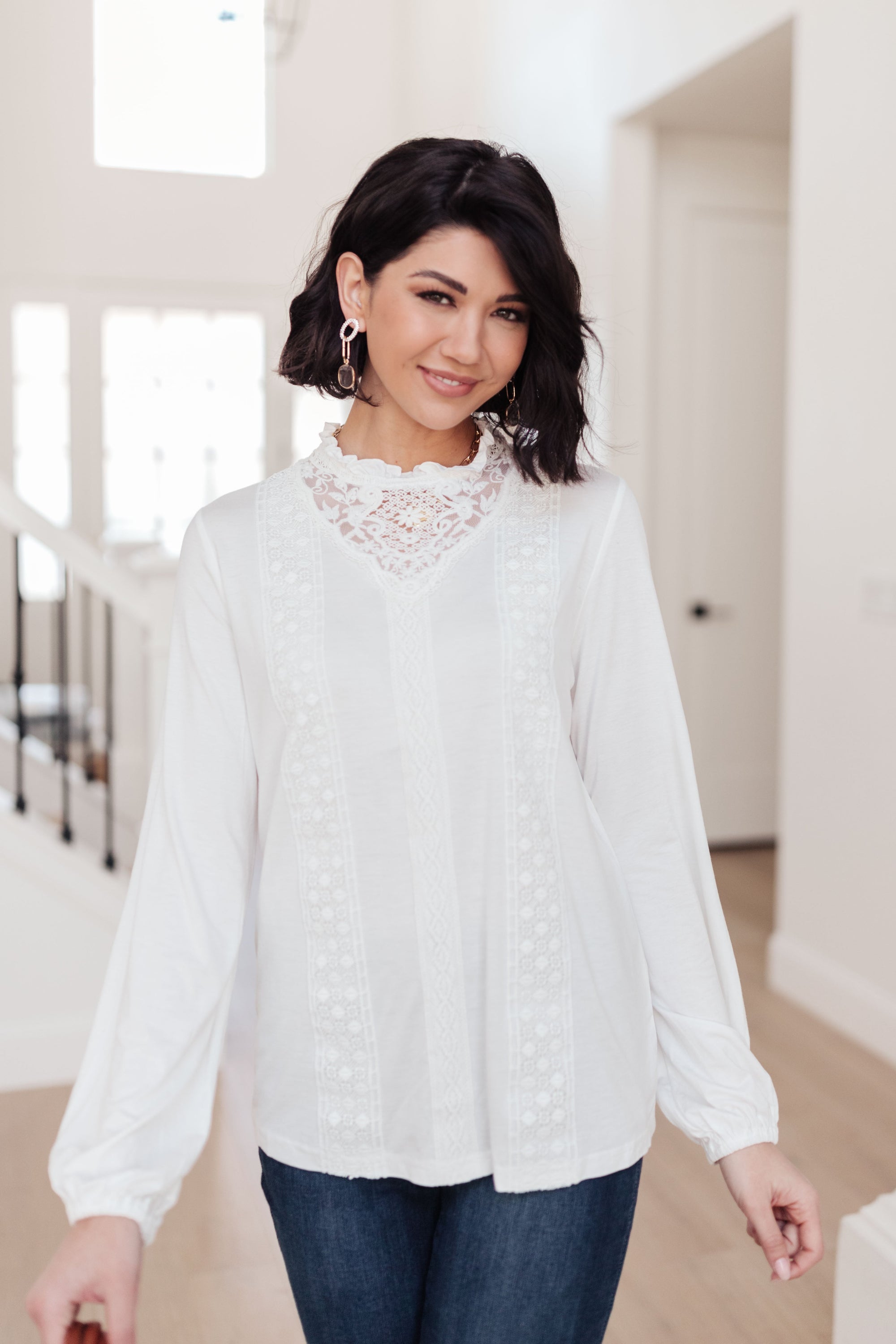 A stylish off white top featuring ruffles and lace overlay, perfect for a Cottage Core aesthetic.