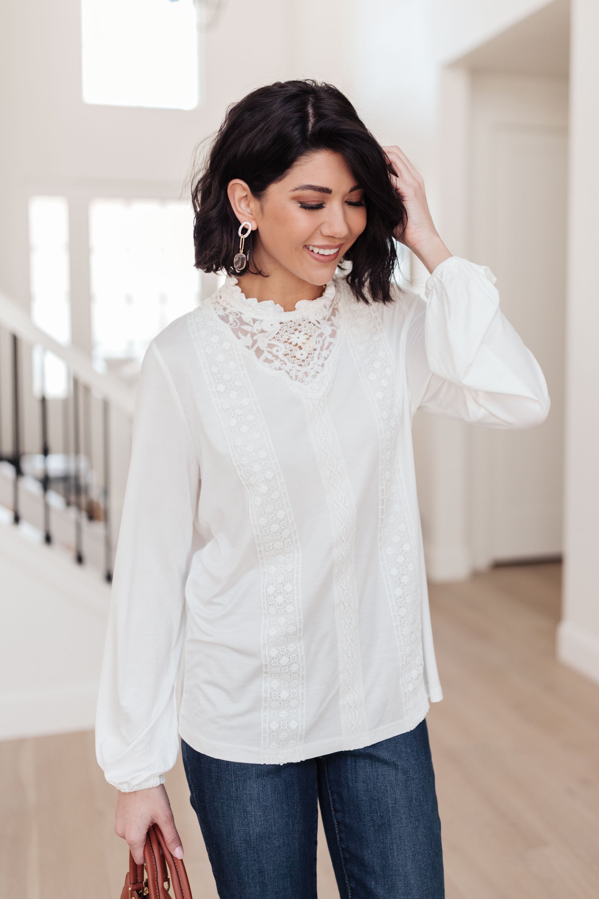 A stylish off white top featuring ruffles and lace overlay, perfect for a Cottage Core aesthetic.