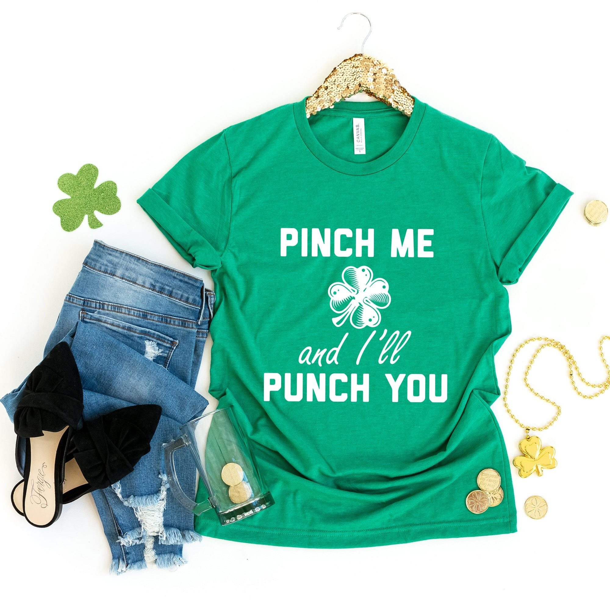 A playful green t-shirt featuring the phrase 'Pinch Me & I'll Punch You' designed for St. Patrick's Day celebrations.