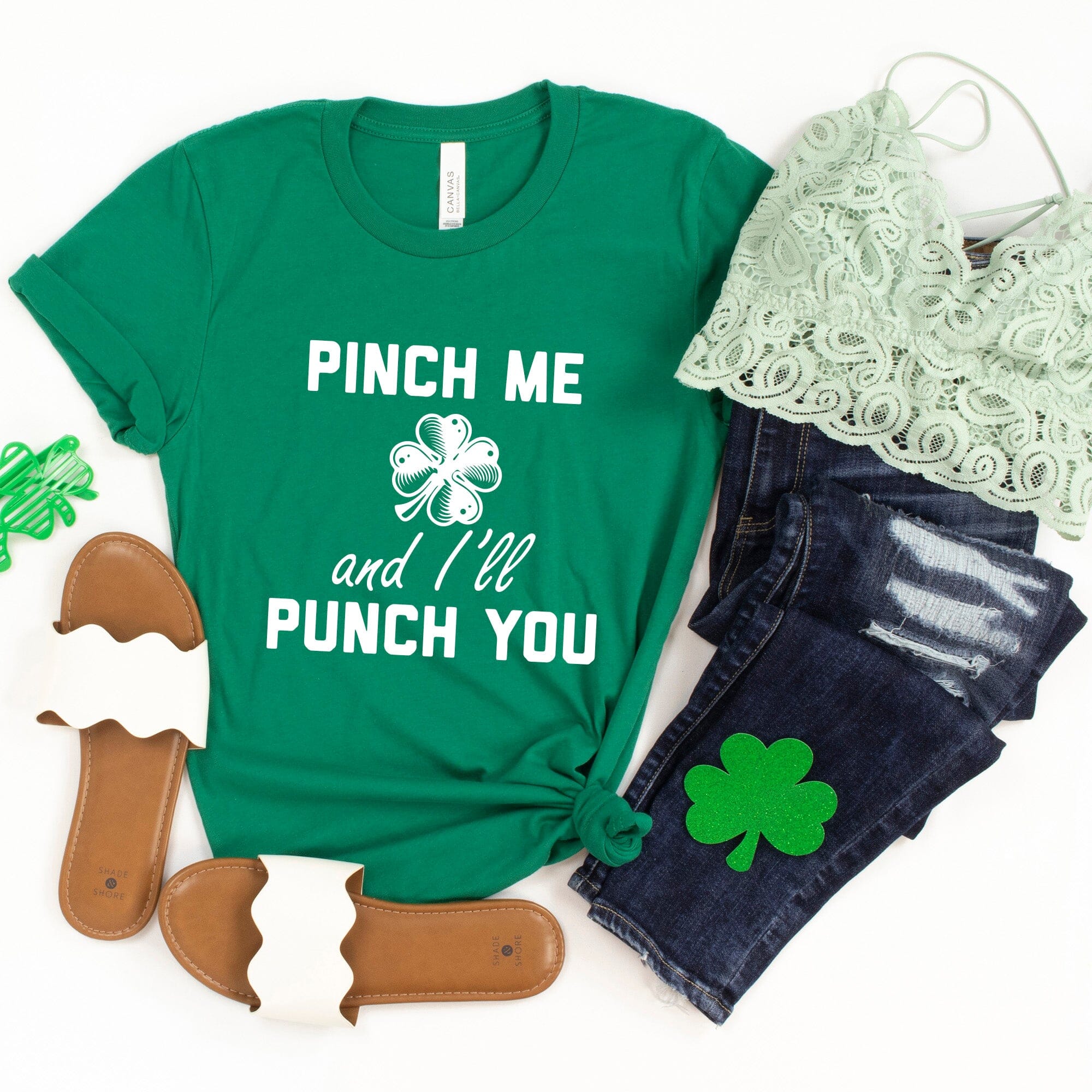 A playful green t-shirt featuring the phrase 'Pinch Me & I'll Punch You' designed for St. Patrick's Day celebrations.