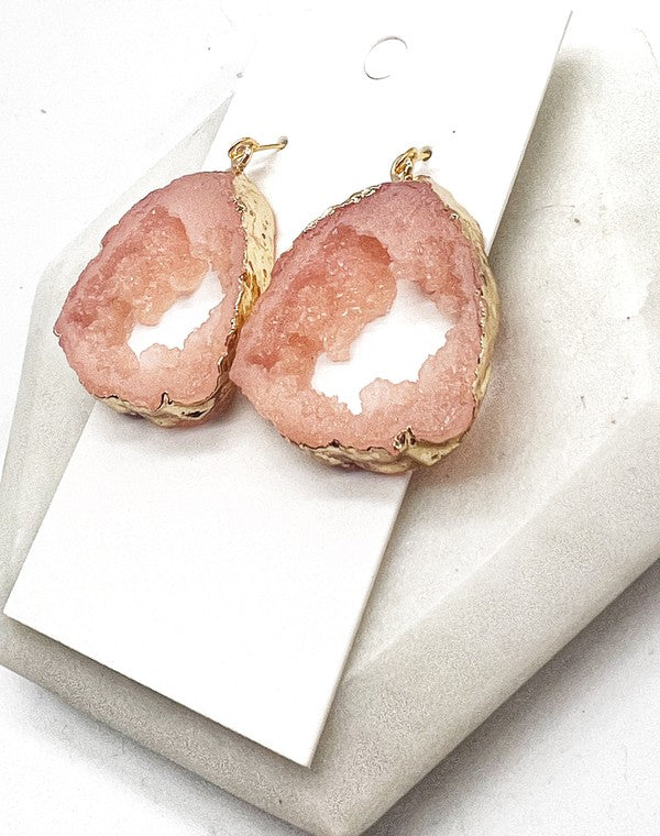 A pair of Pink Coral Agate Slice Resin Statement Earrings with gold accents, showcasing unique pink patterns and a stylish design.