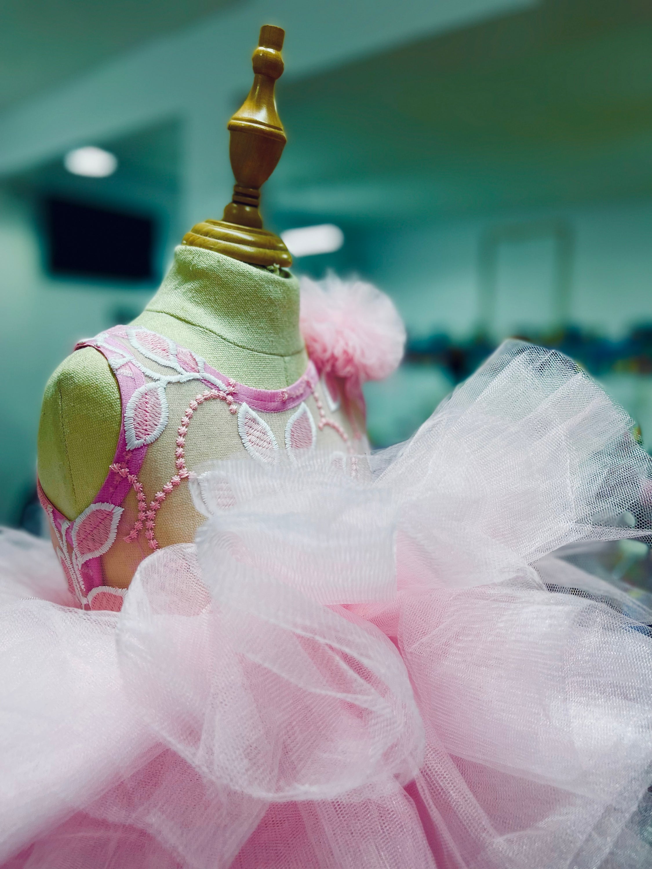 Adorable pink dress for baby girls featuring a cupcake design, perfect for first birthday celebrations.