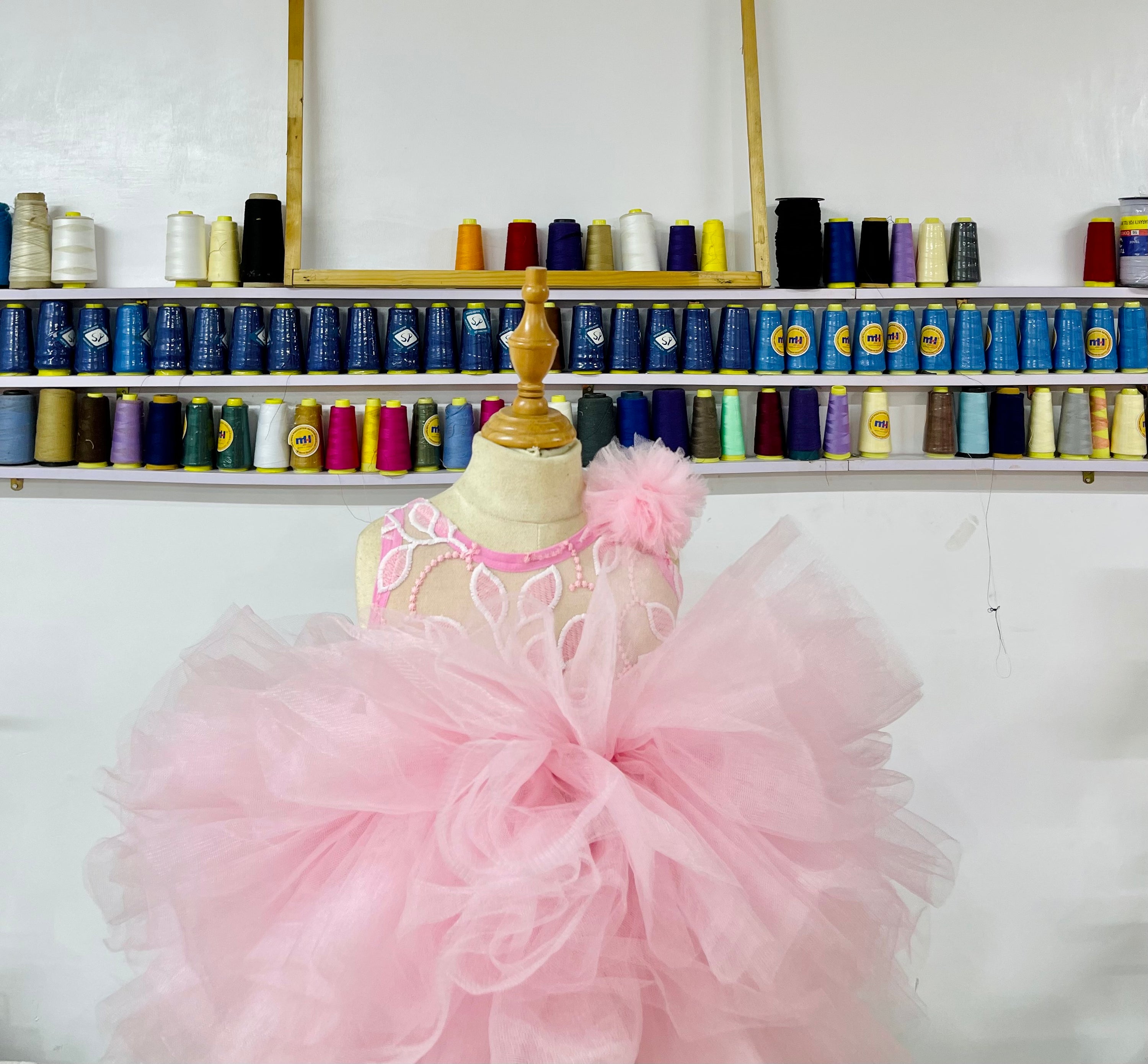 Adorable pink dress for baby girls featuring a cupcake design, perfect for first birthday celebrations.