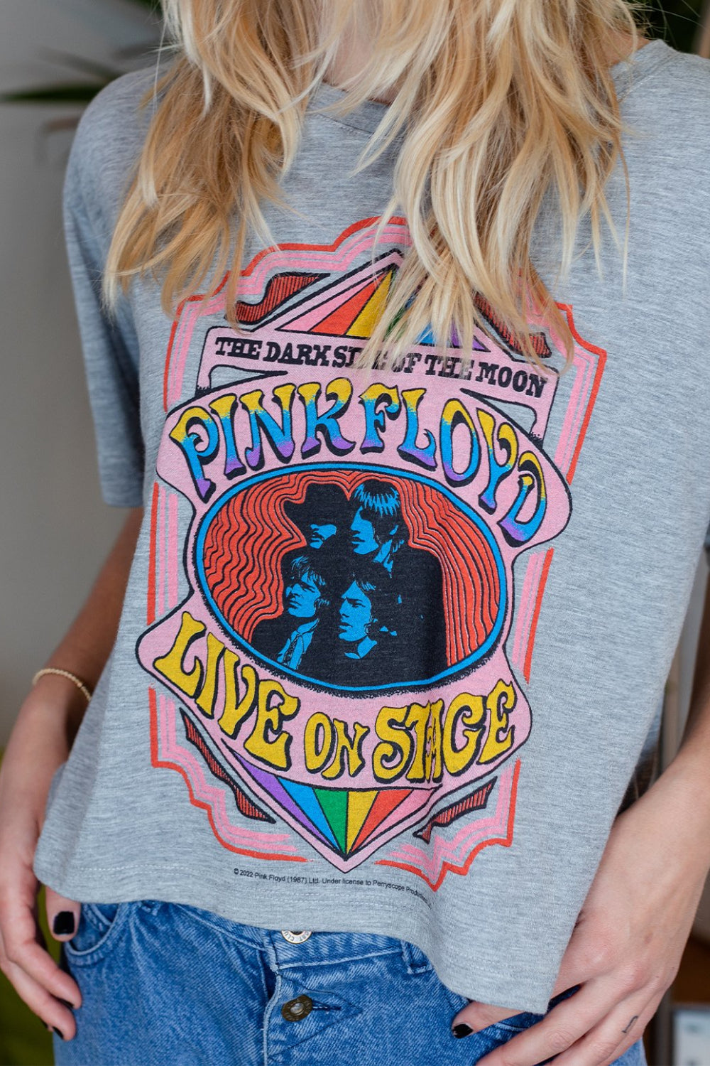 A stylish cropped tee featuring the Pink Floyd Dark Side Of The Moon graphic, made from 100% organic cotton in heather gray color.