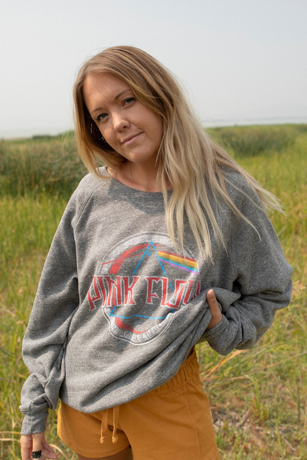 A stylish Pink Floyd oversized sweatshirt in heather gray, featuring a crew neck and iconic logo, made from 100% organic cotton.