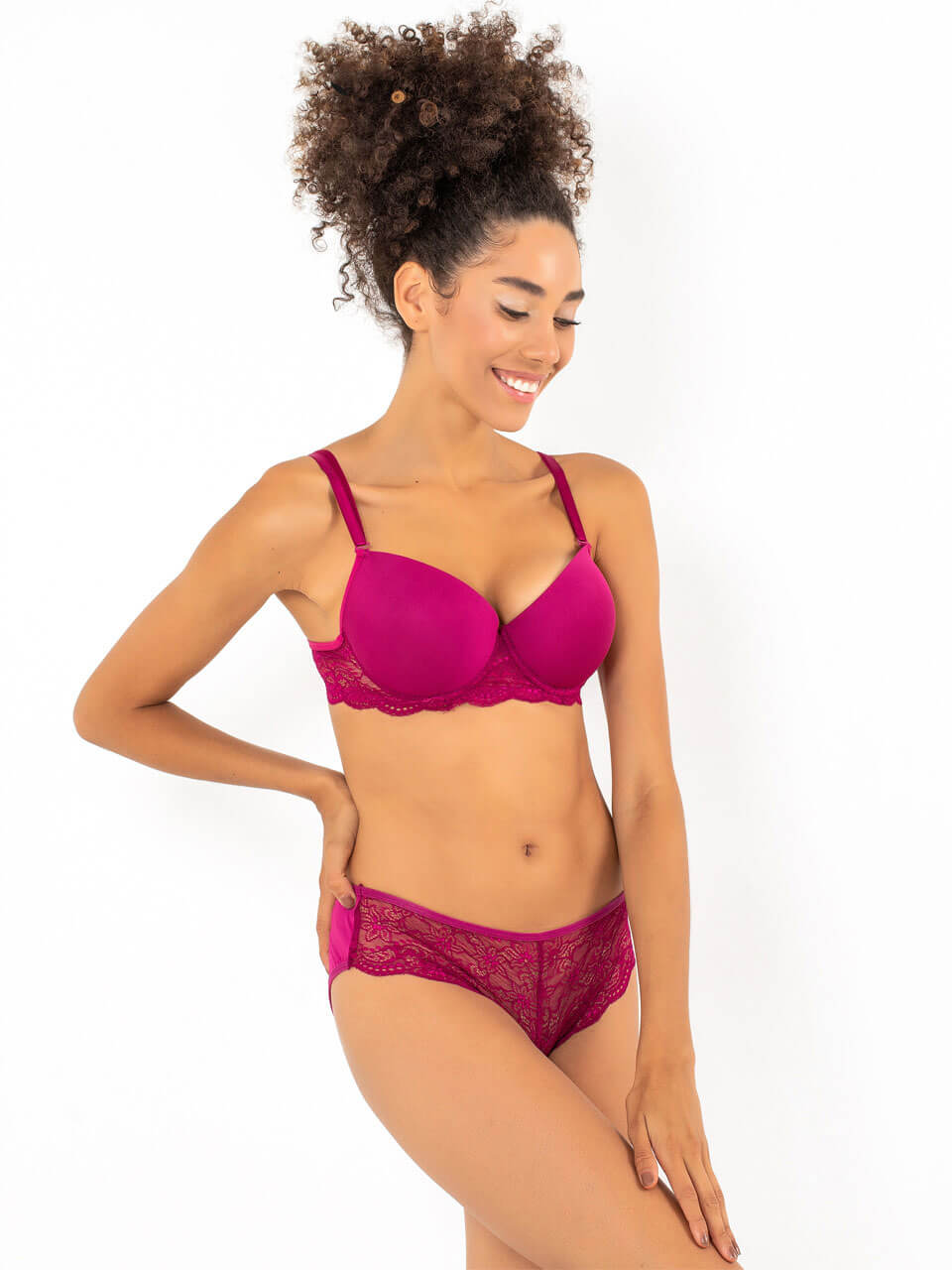 A seductive pink lace bra and panty set featuring intricate lace detailing and a comfortable fit, perfect for enhancing allure.