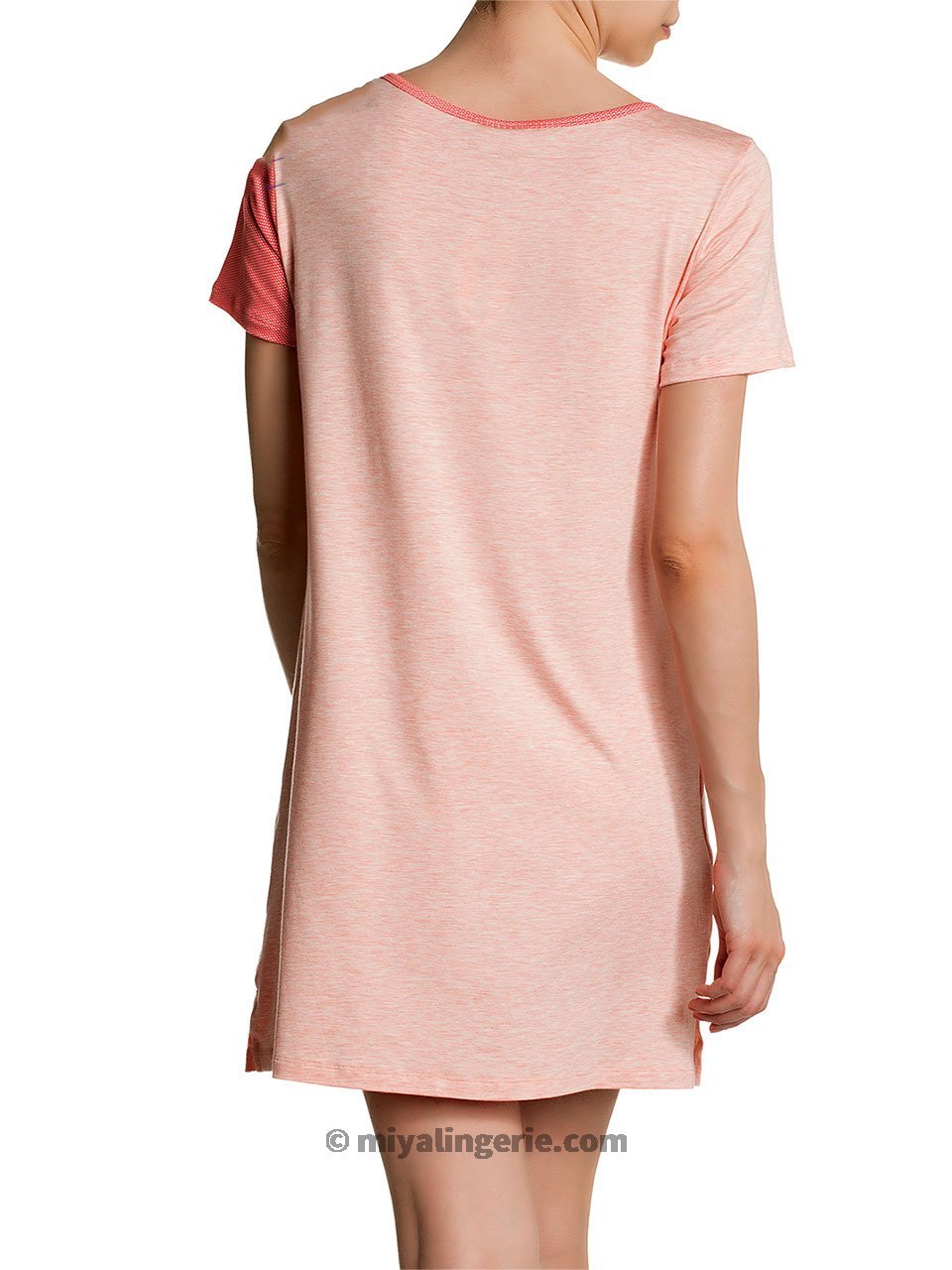 A stylish pink midi T shirt dress displayed on a mannequin, showcasing its soft fabric and versatile design.