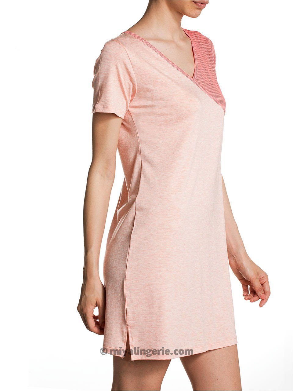 A stylish pink midi T shirt dress displayed on a mannequin, showcasing its soft fabric and versatile design.