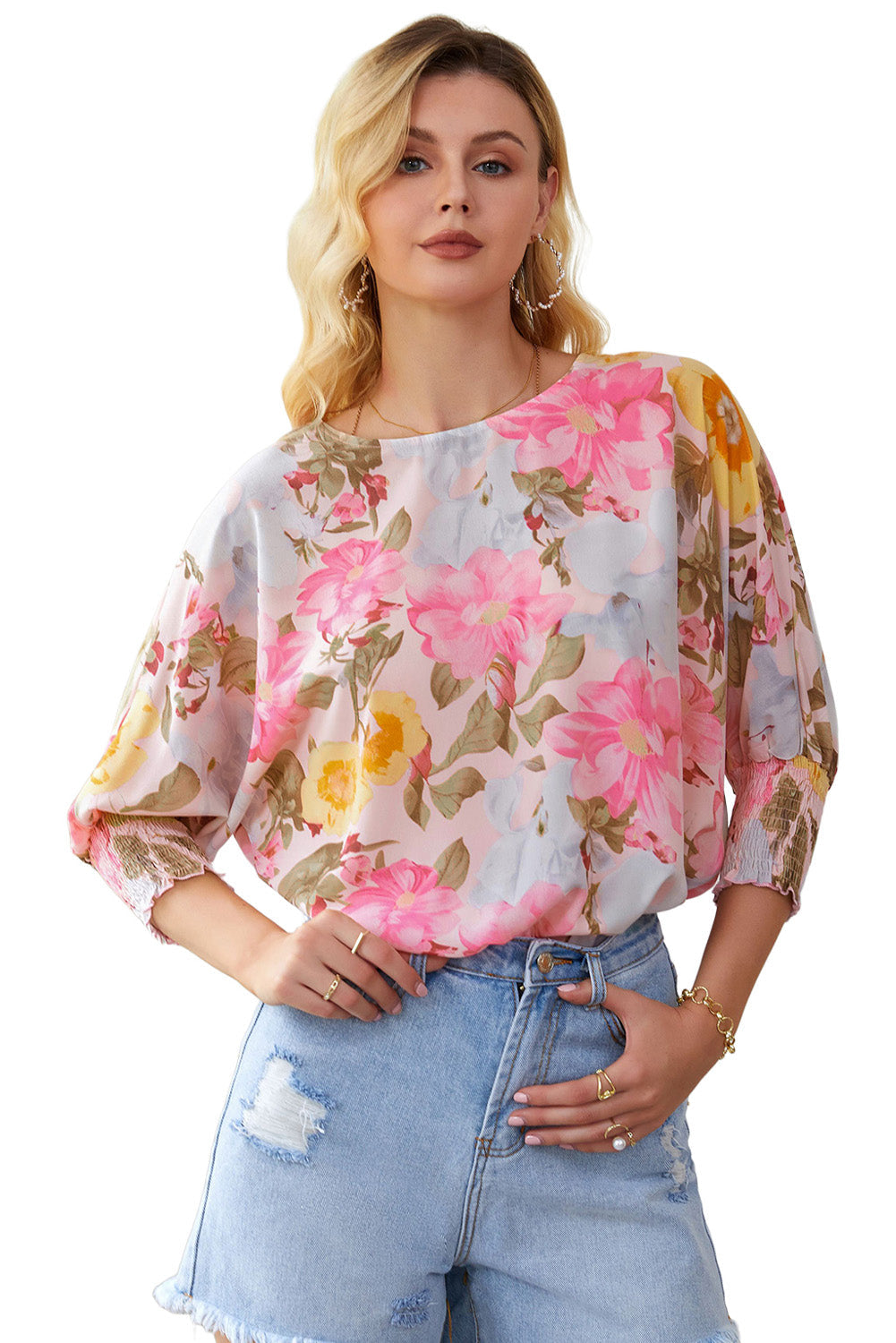 A stylish pink floral blouse with shirred cuffs and 3/4 sleeves, showcasing a loose fit design perfect for various occasions.